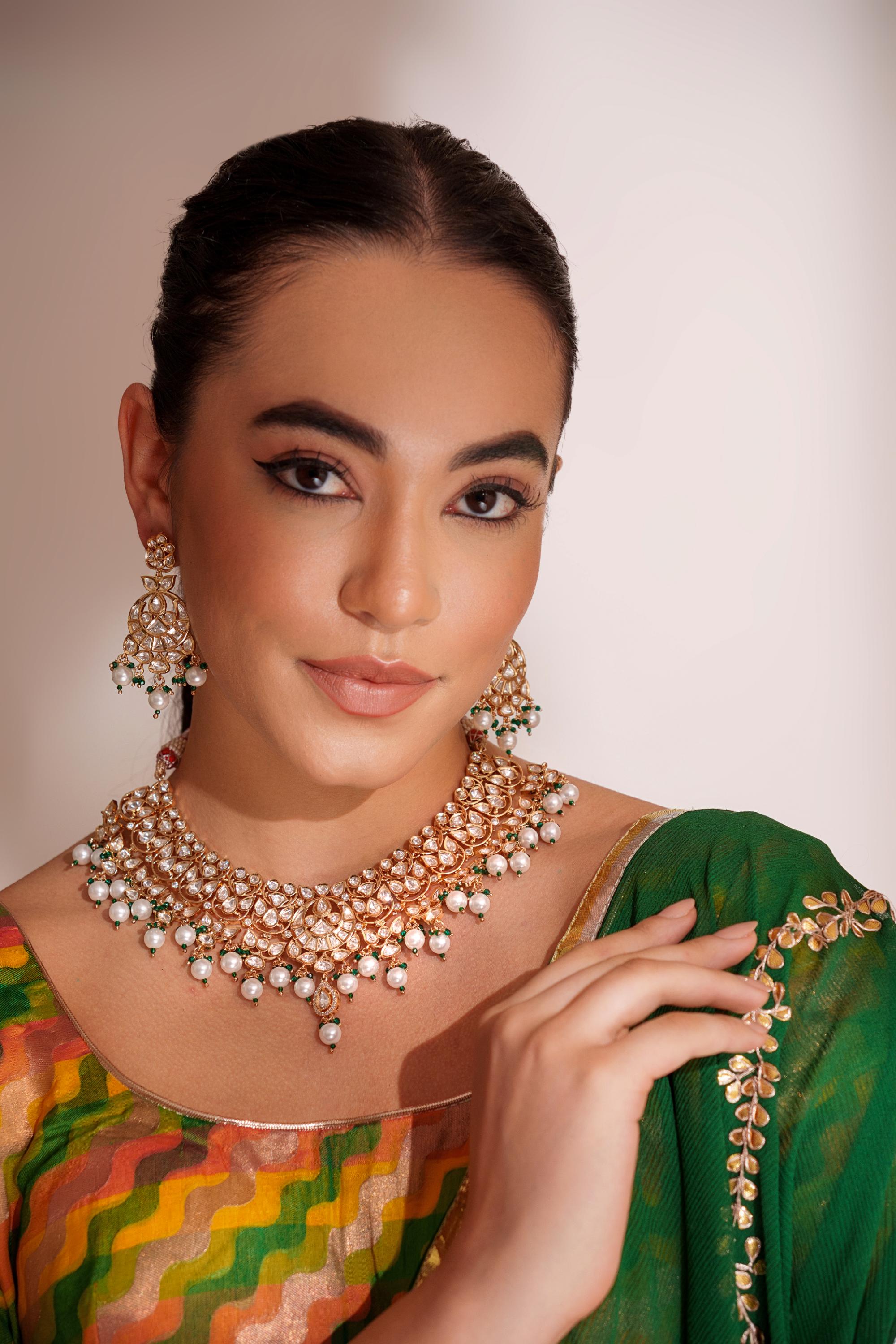 Elegant and classy kundan necklace set with earrings studded with pearls