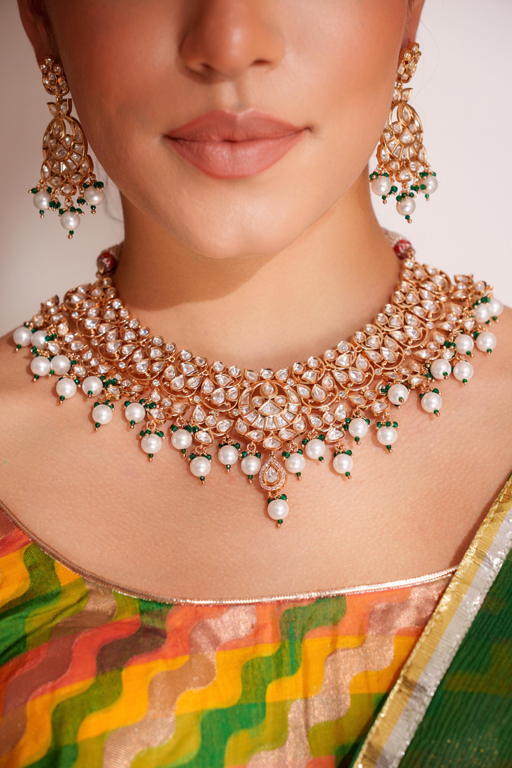 Elegant and classy kundan necklace set with earrings studded with pearls