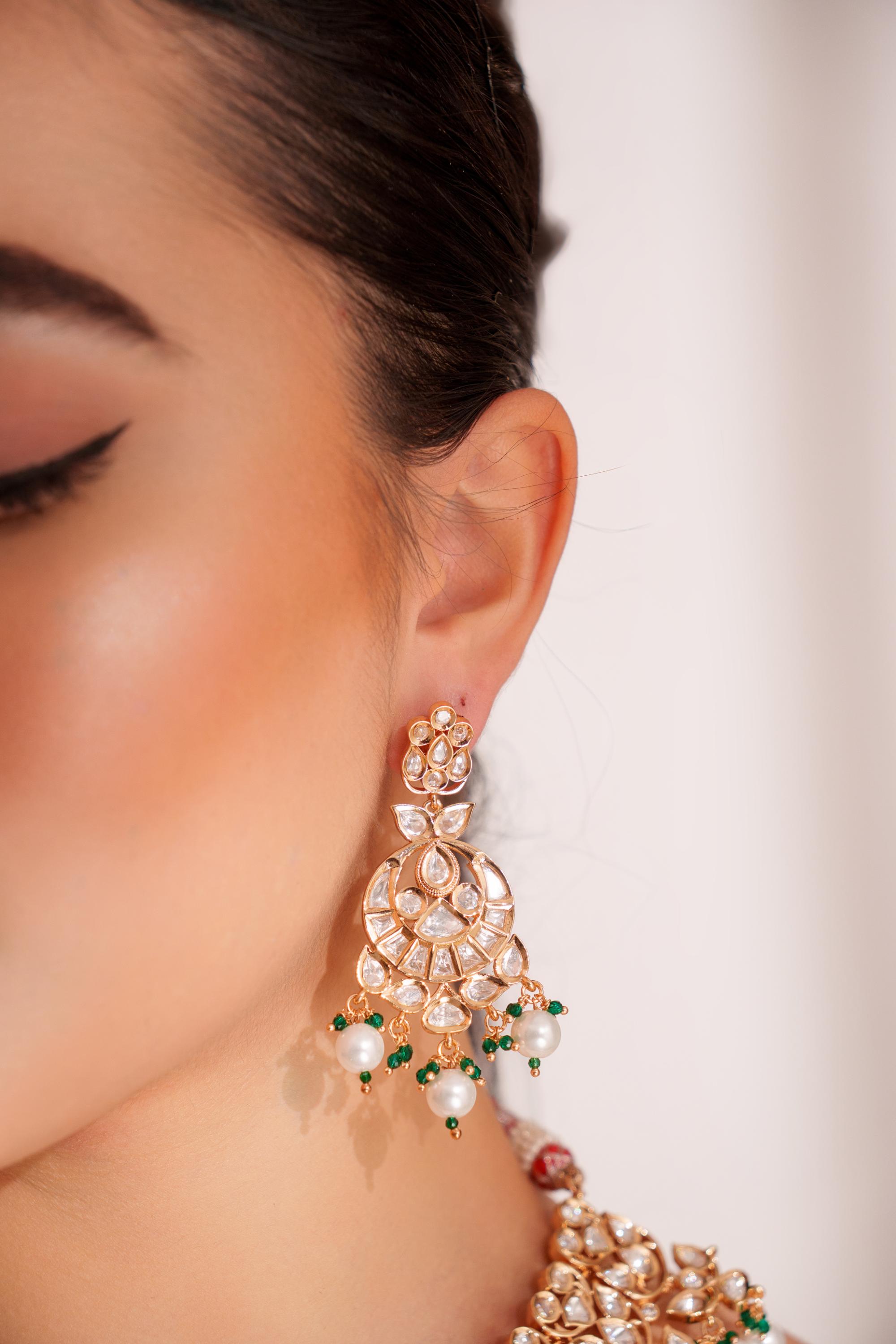 Elegant and classy kundan necklace set with earrings studded with pearls