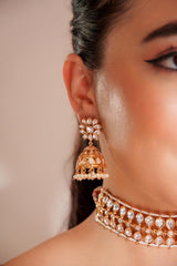 Classy kundan choker set with elegant pair of jhumkis.