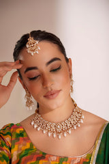 Elegant and classy kundan necklace set with earrings and maangtikka studded with pearls