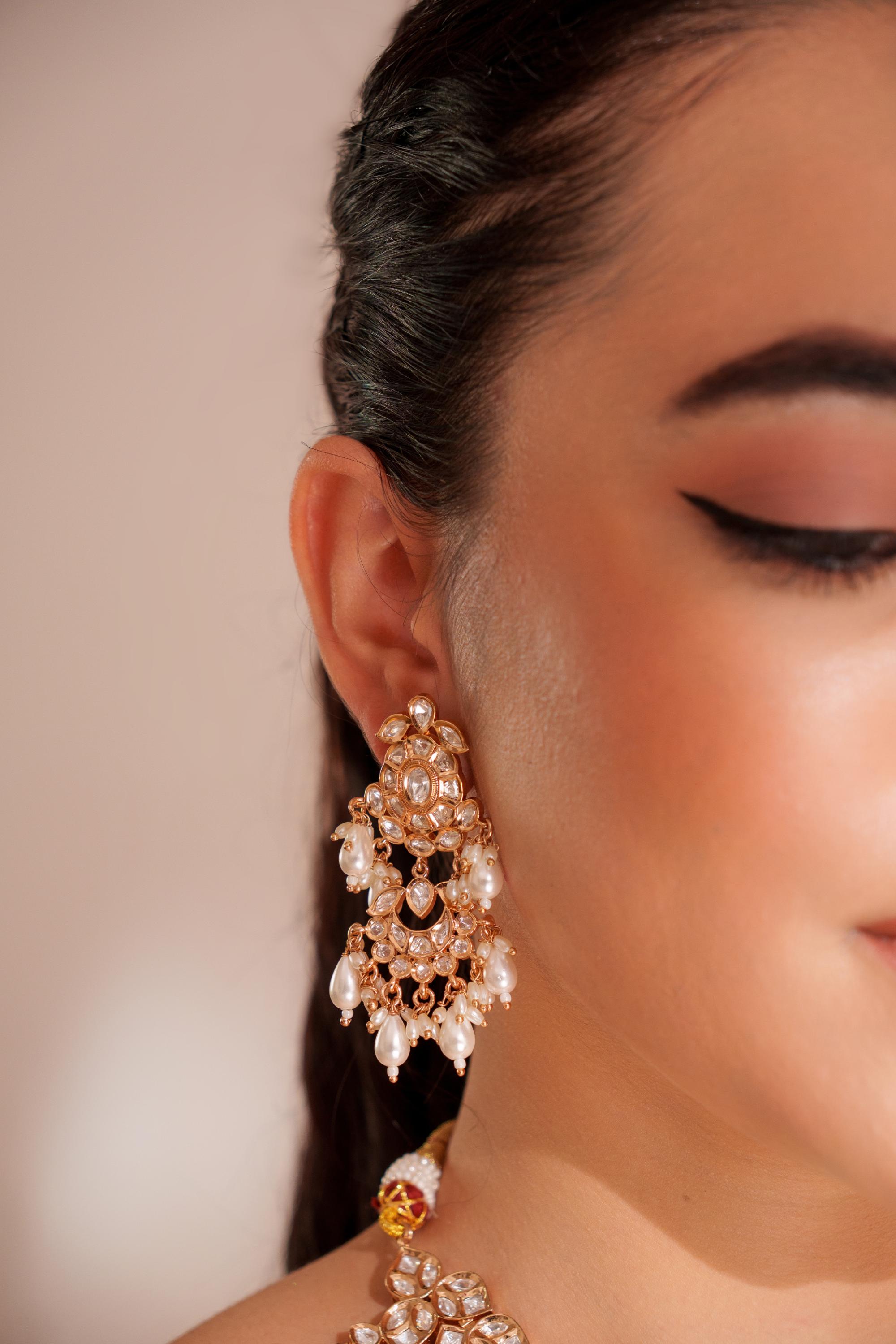 Elegant and classy kundan necklace set with earrings and maangtikka studded with pearls