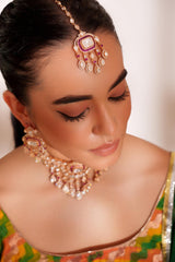 Bold and dramatic two tone finish polki choker set