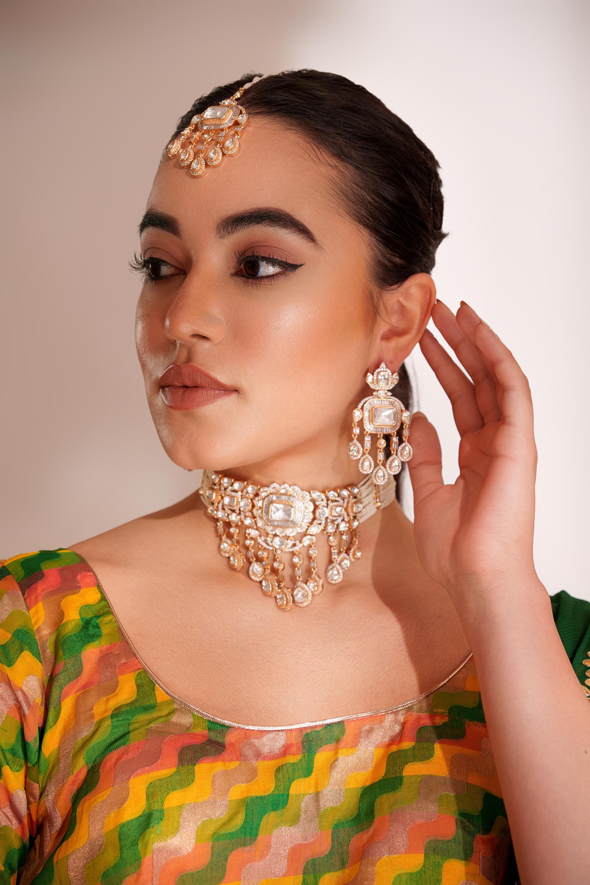 Bold and dramatic two tone finish polki choker set