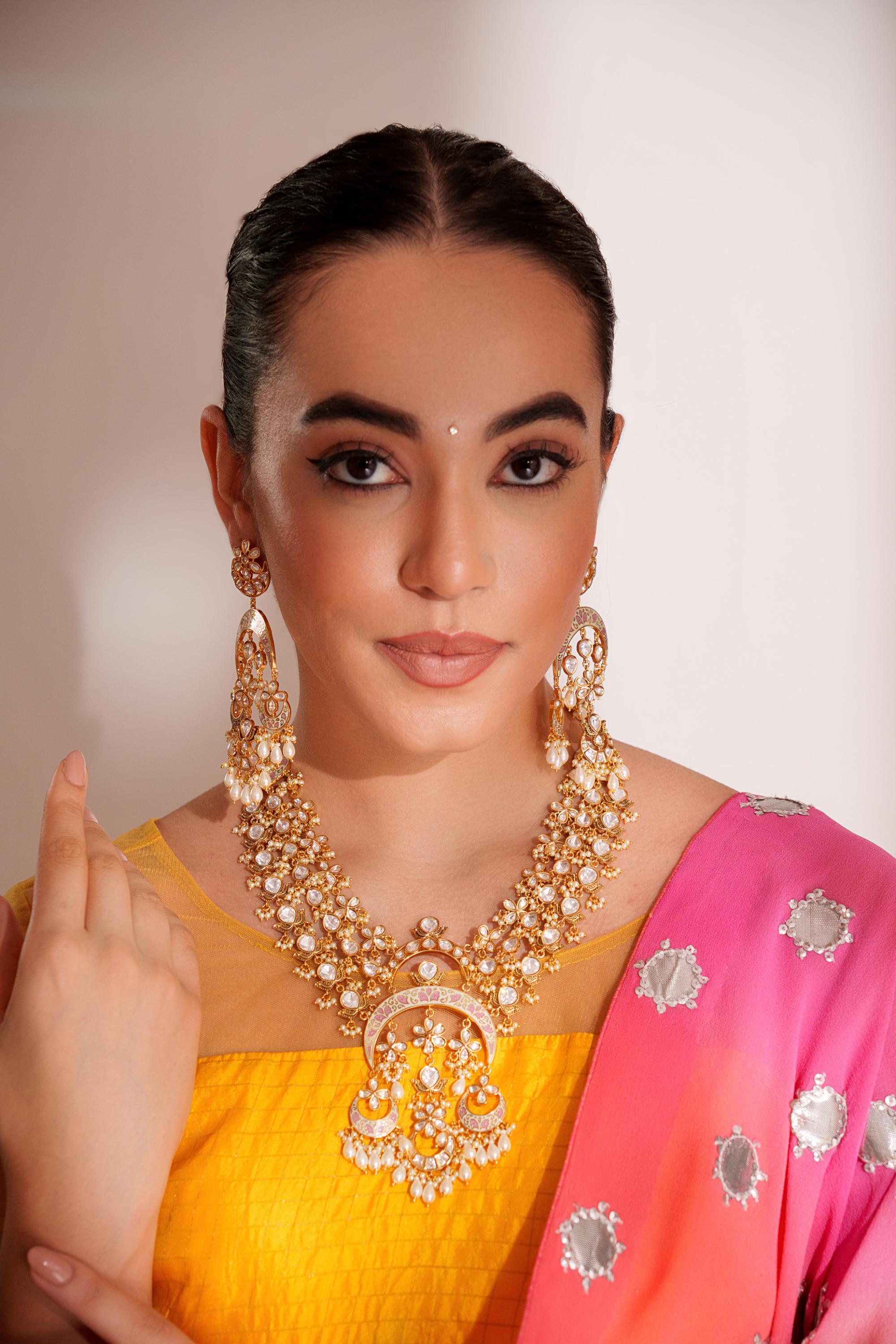 Bold and dramatic kundan long pendant necklace with elegant earrings