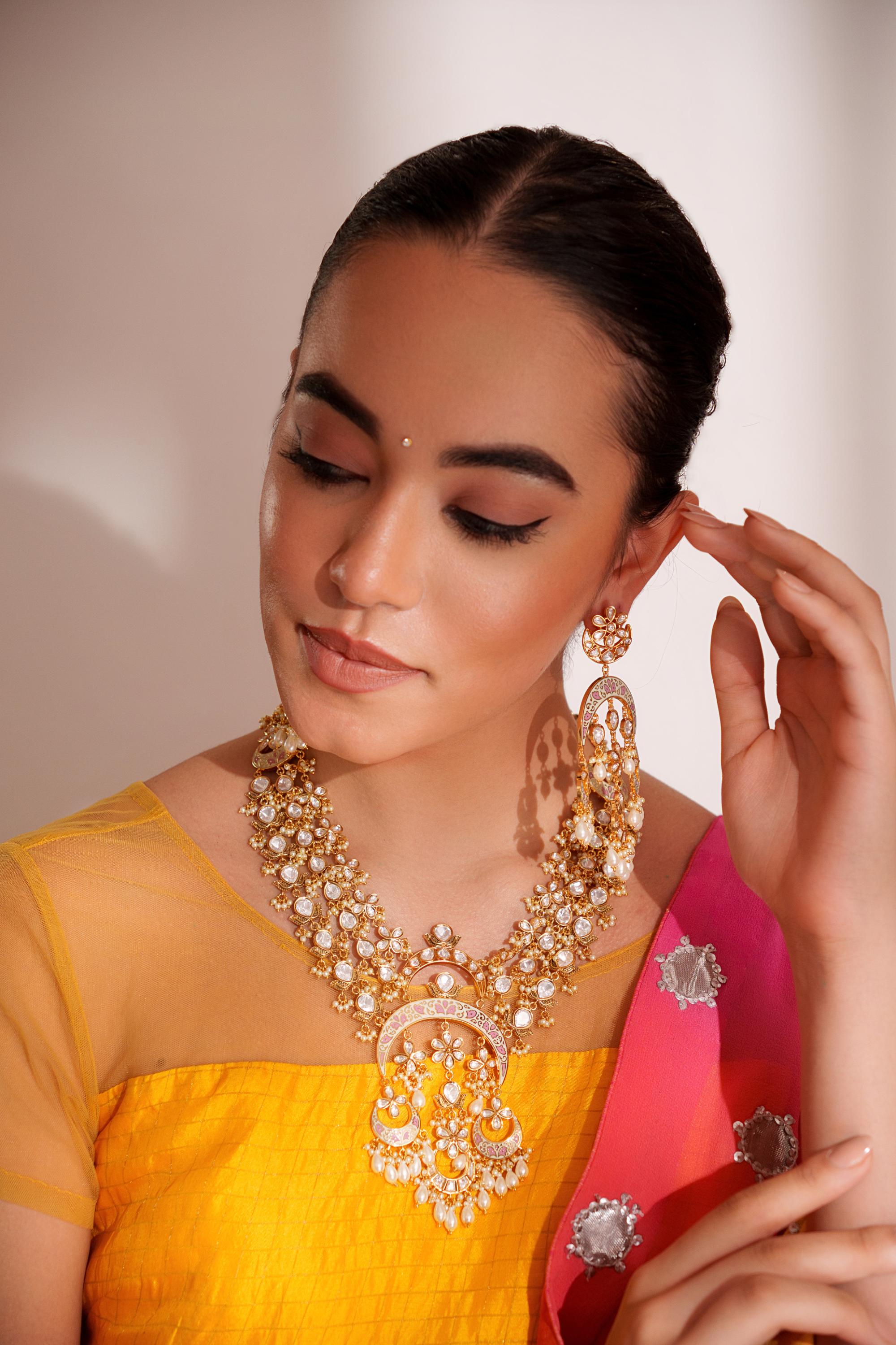 Bold and dramatic kundan long pendant necklace with elegant earrings