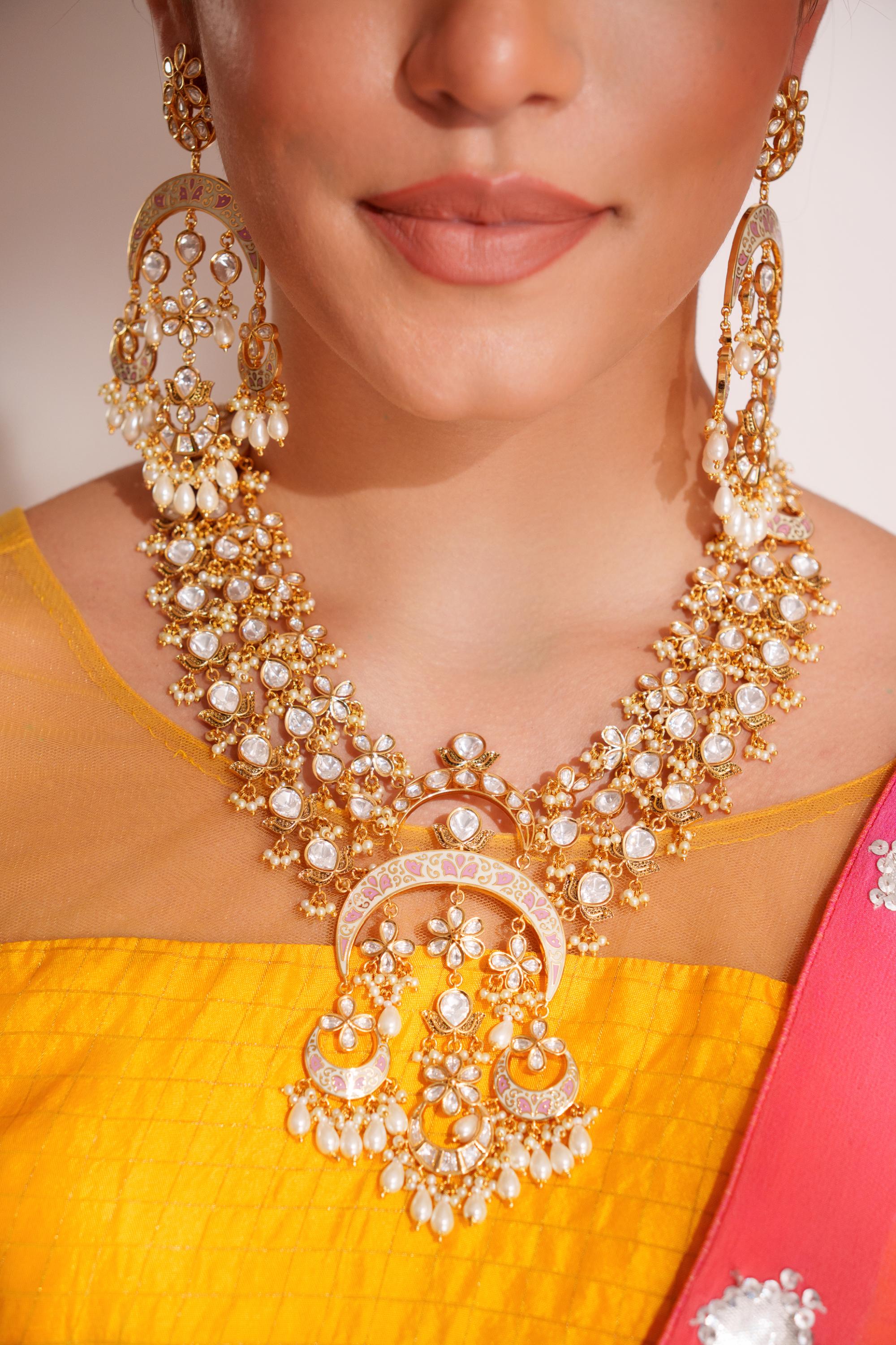 Bold and dramatic kundan long pendant necklace with elegant earrings