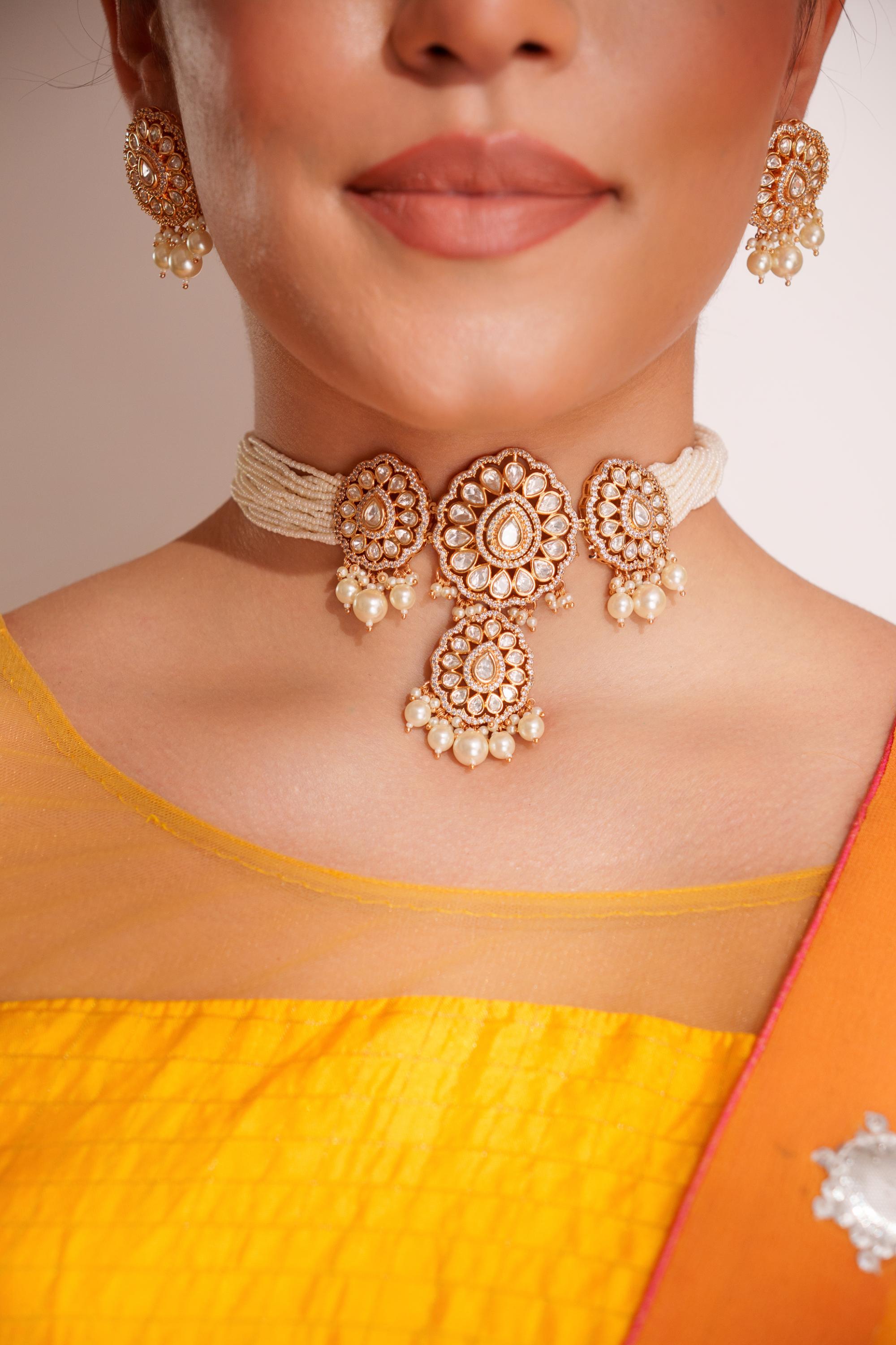 Classy kundan choker with elegant pair of earrings.