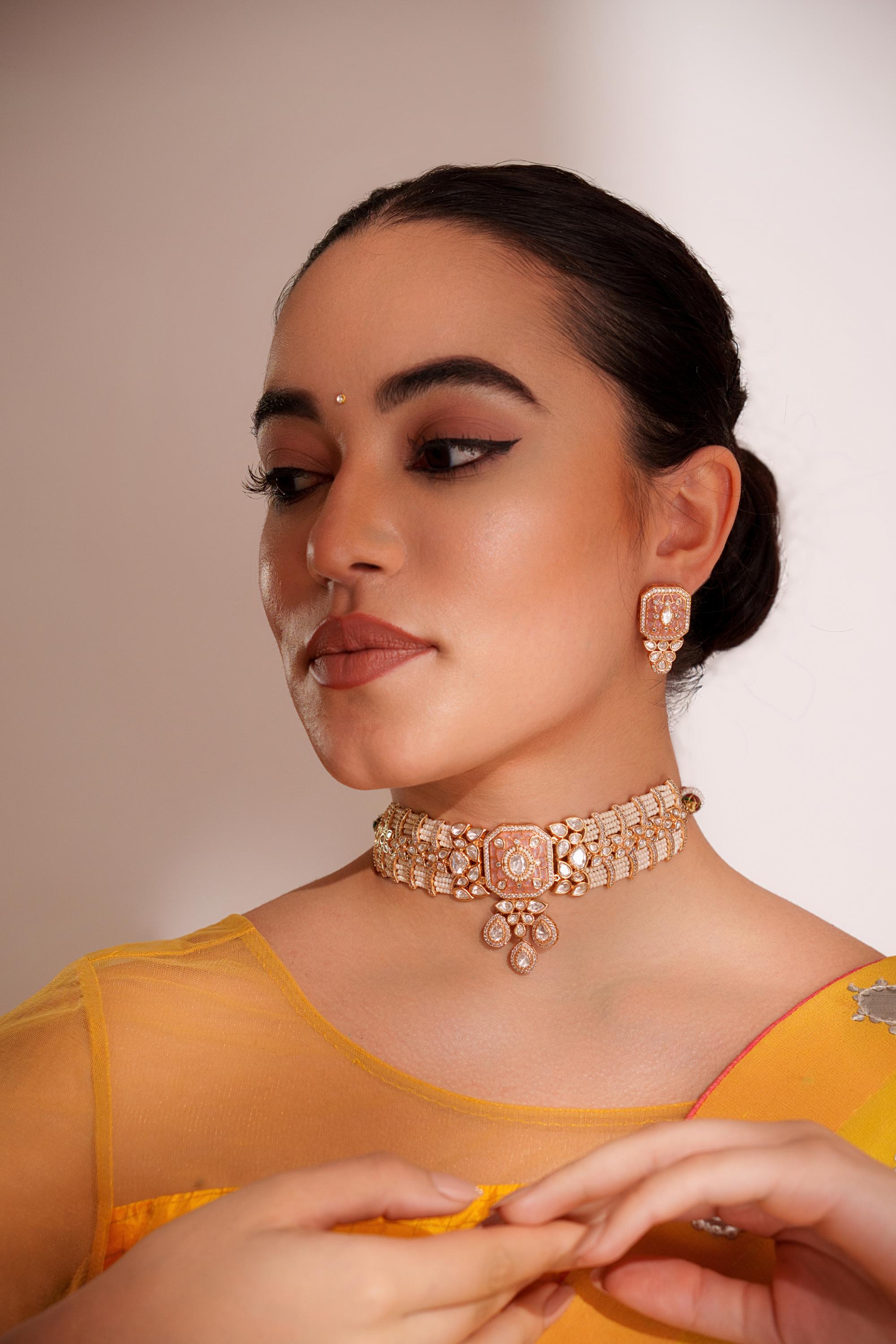 Classy kundan choker with elegant pair of earrings.