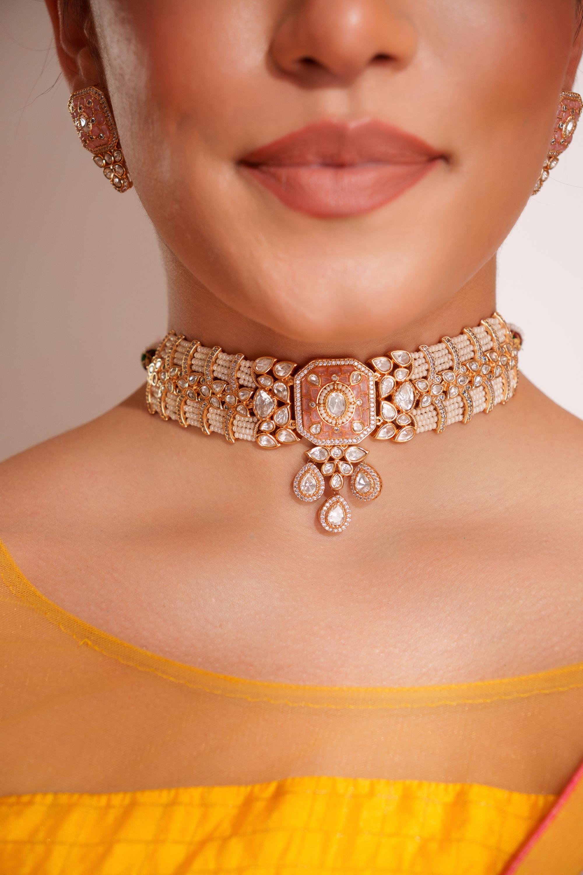 Classy kundan choker with elegant pair of earrings.
