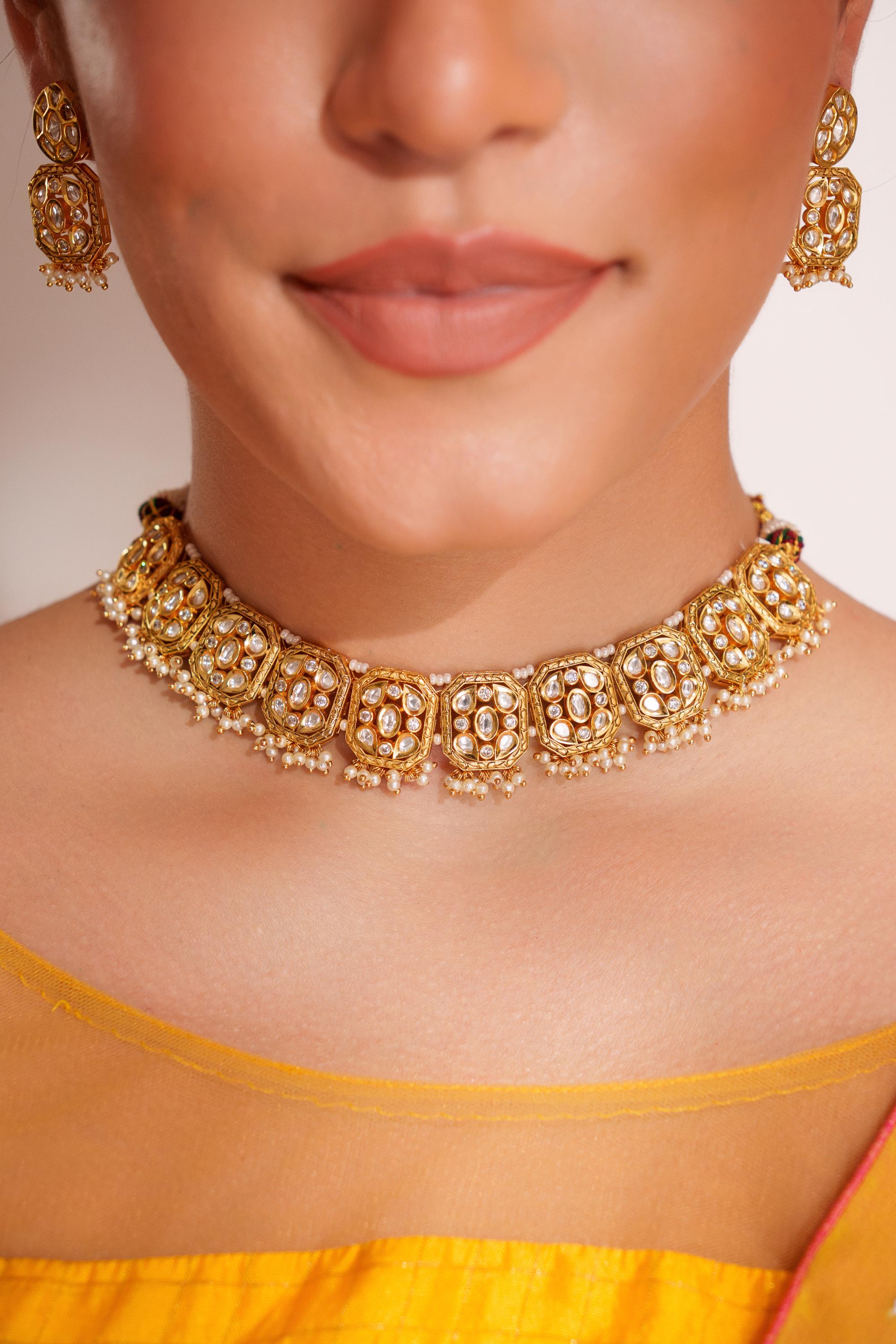 Classy kundan choker with elegant pair of earrings.