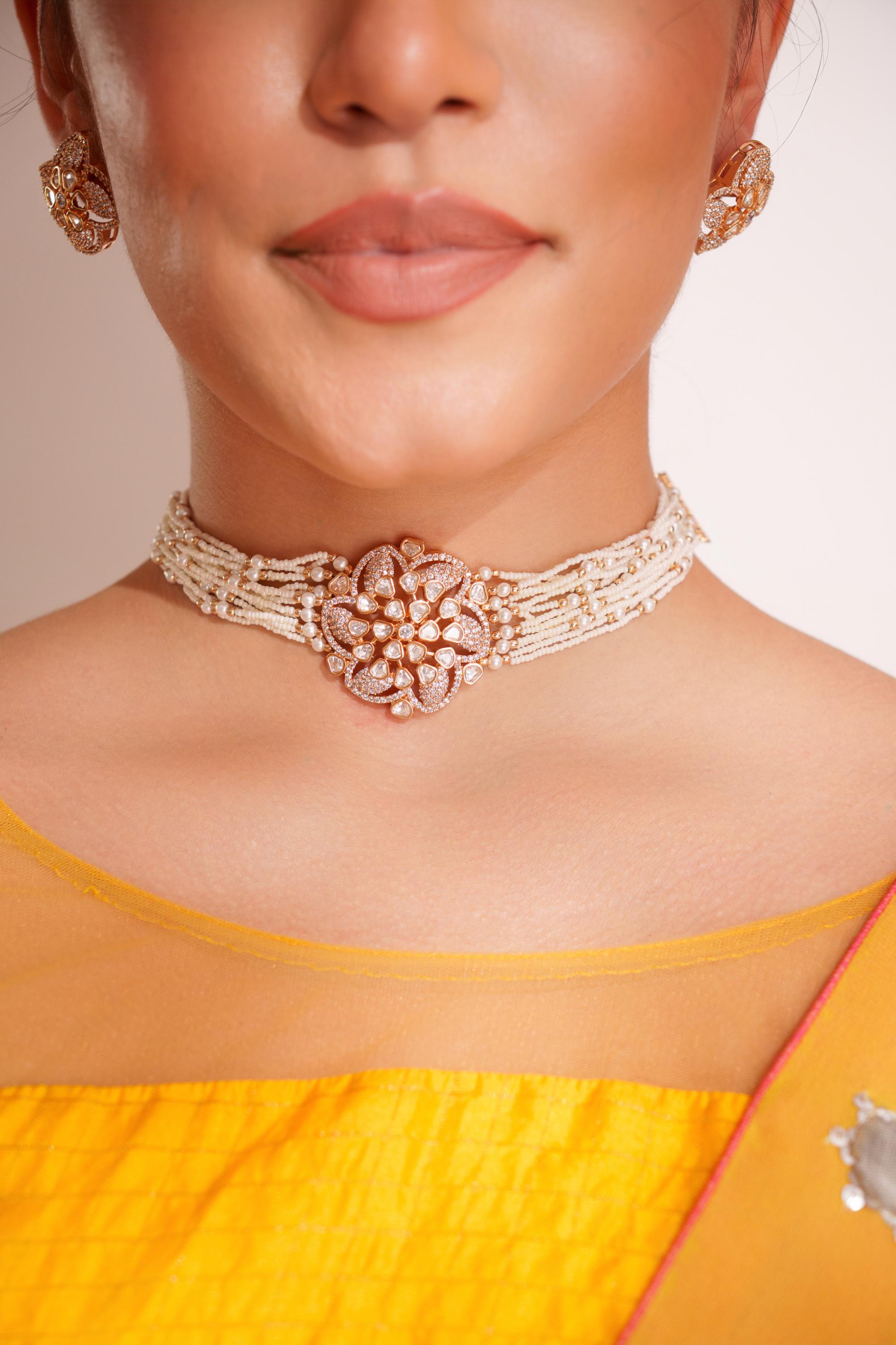 Classy kundan choker set with elegant pair of earrings.