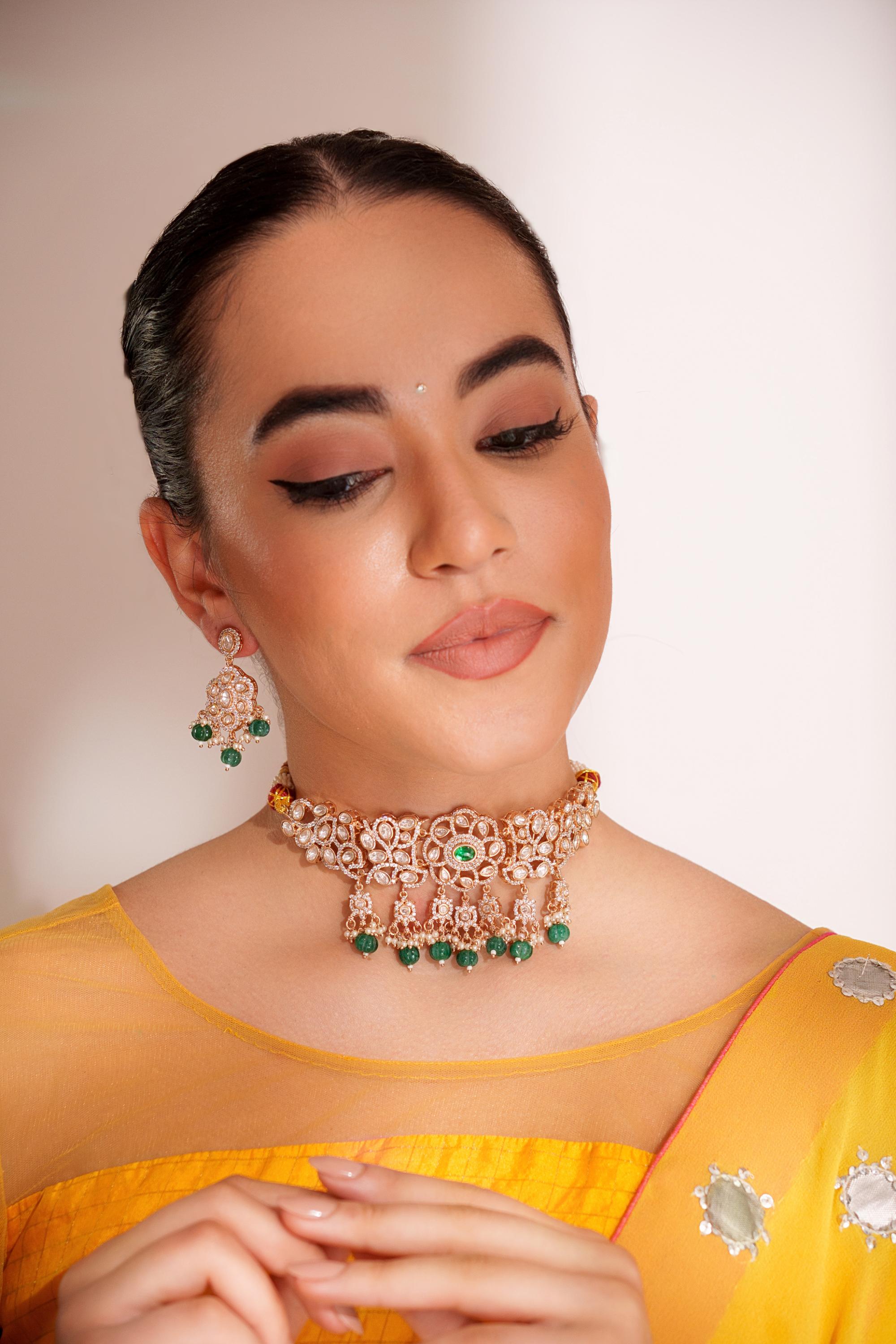 Classy kundan choker set with elegant pair of earrings.