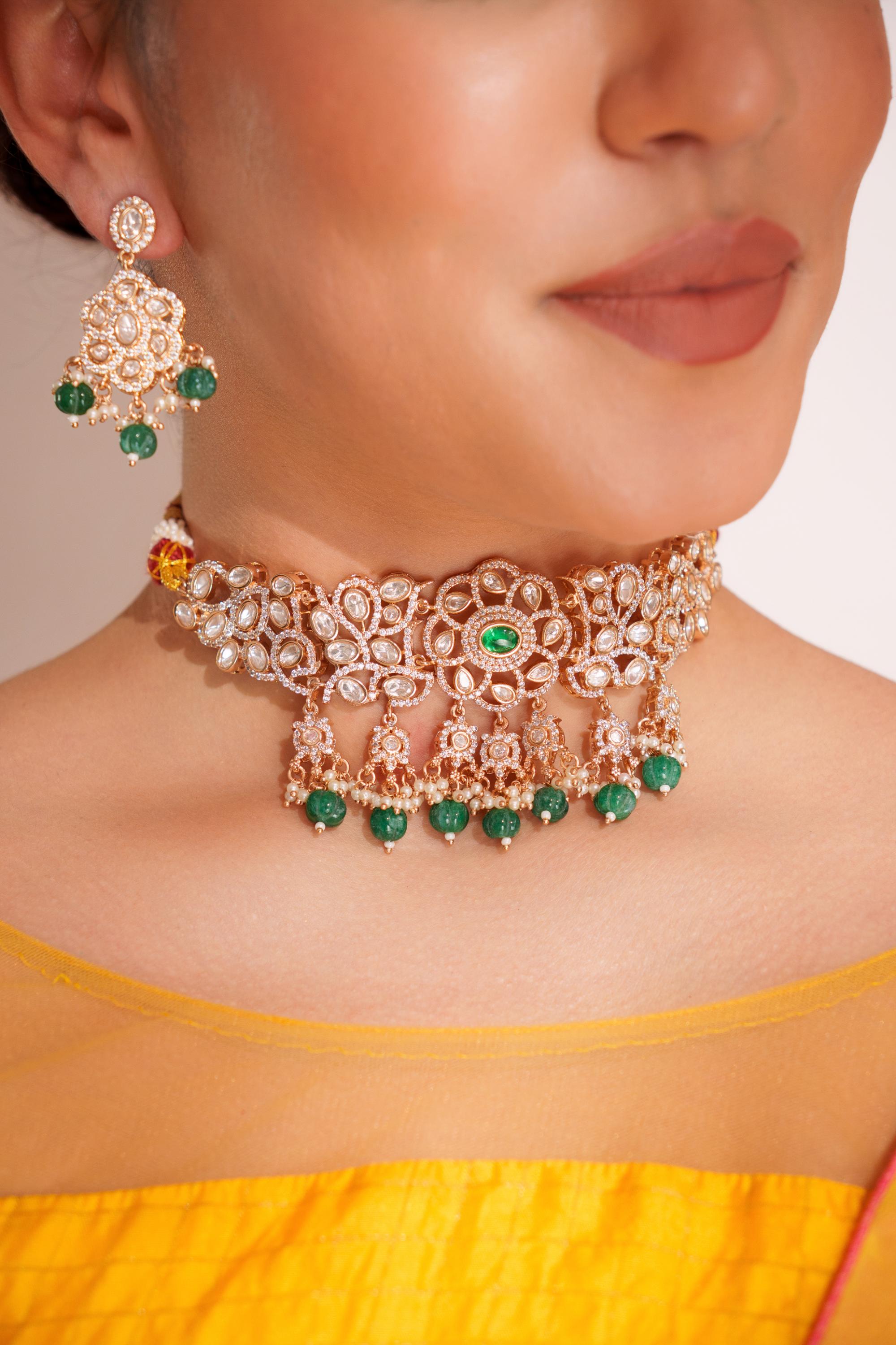 Classy kundan choker set with elegant pair of earrings.