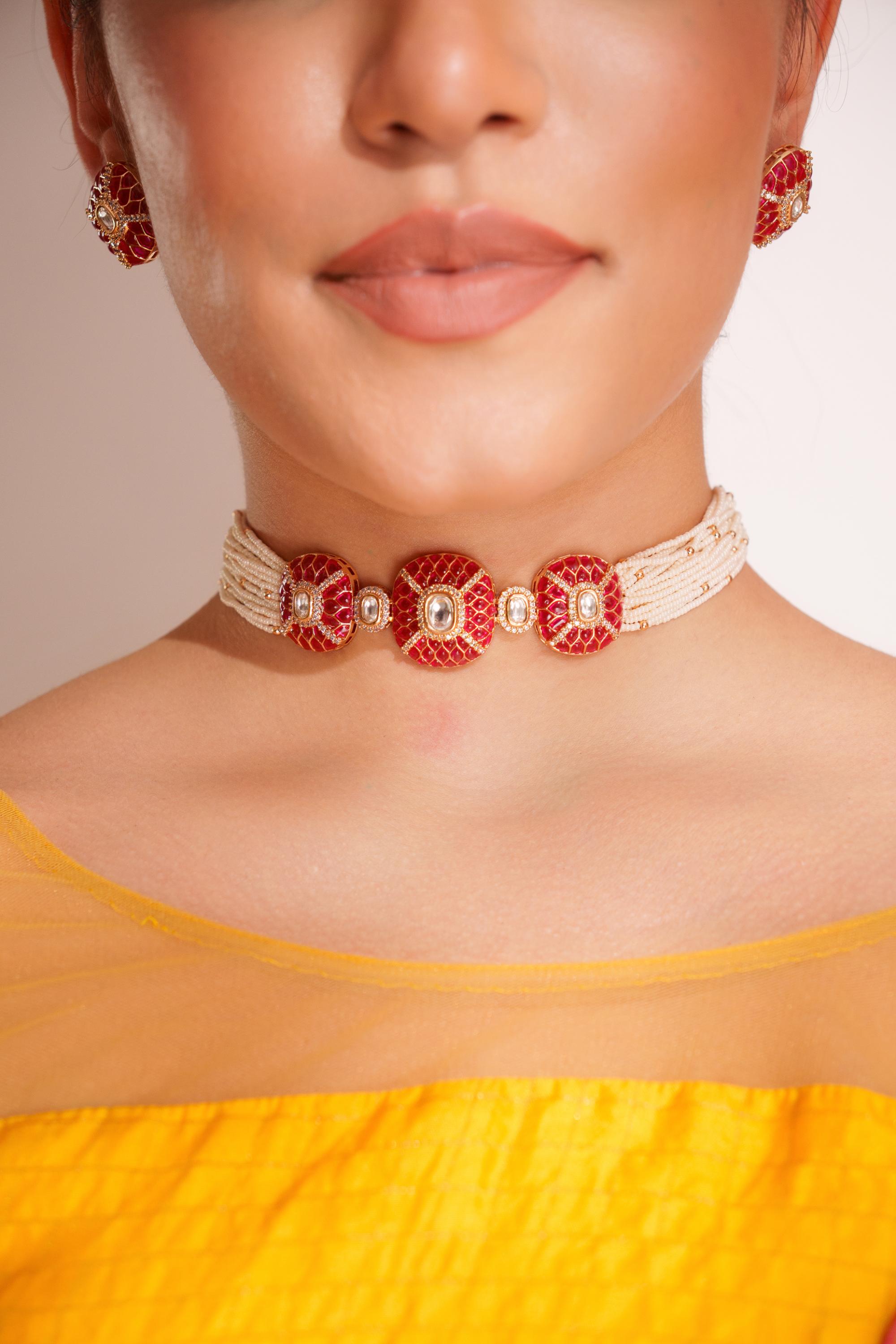 Classy kundan choker with elegant pair of earrings.