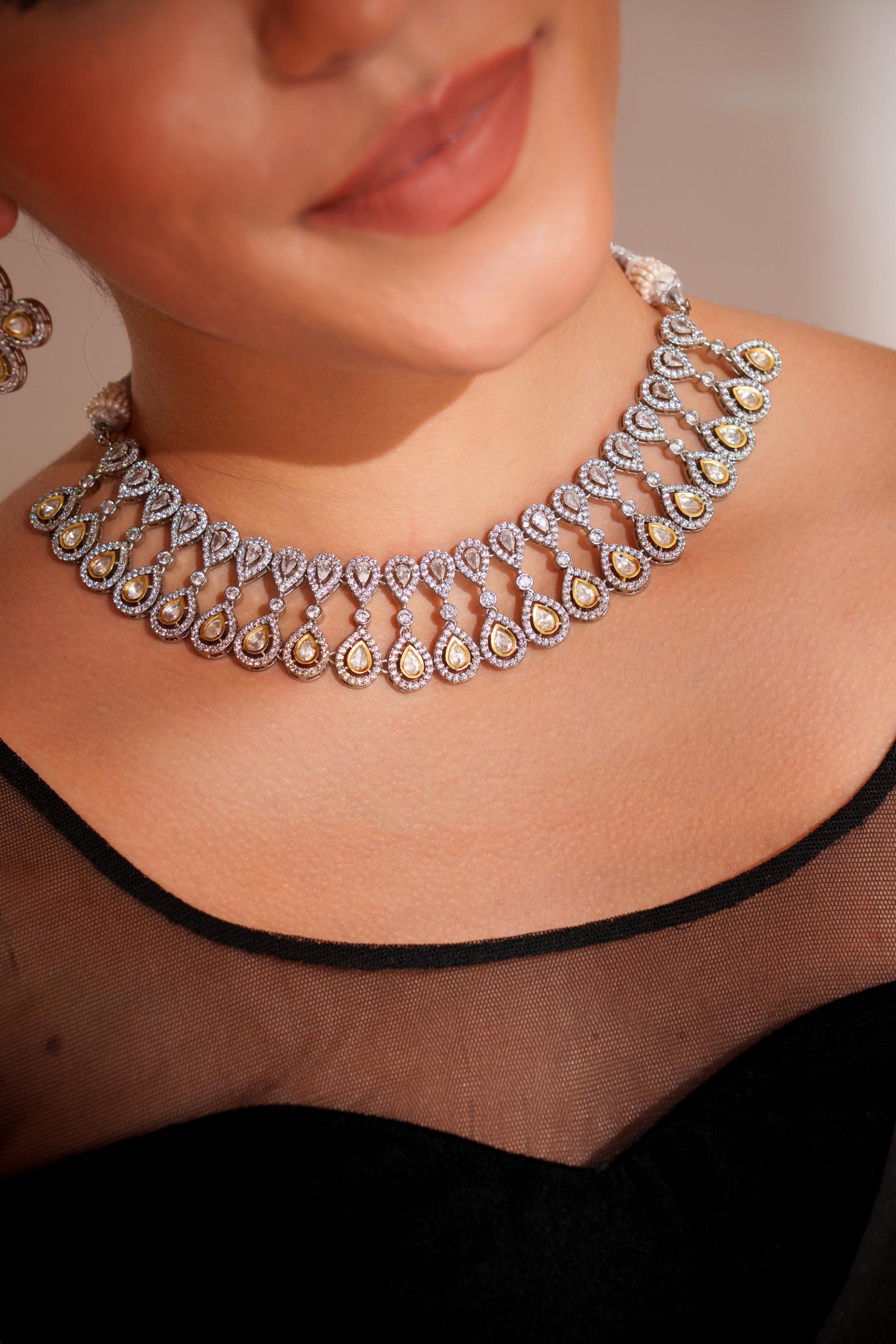 Dramatic and stylish zircon stone necklace set with matching earrings