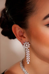 Delicate yet elegant diamond pendant necklace with matching earrings