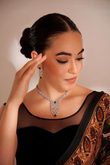 Elegant and sleek diamond pendant set with emerald stone and earrings