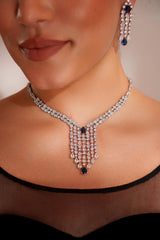 Elegant and sleek diamond pendant set with sapphire stone and earrings