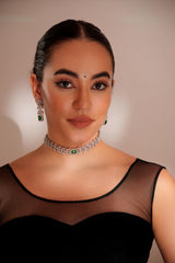 Elegant diamond choker with emerald stone and earrings