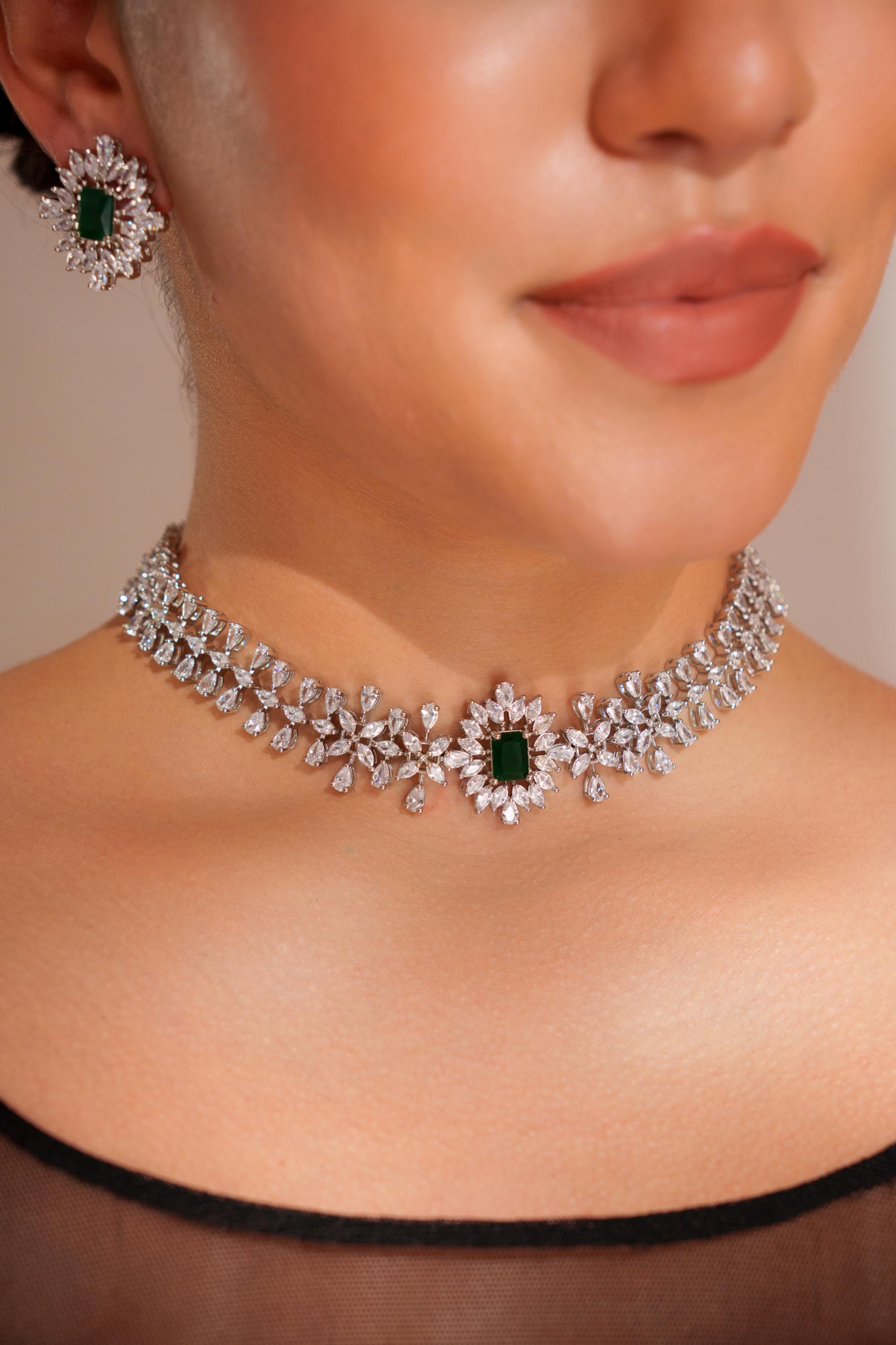 Elegant diamond choker with emerald stone and earrings