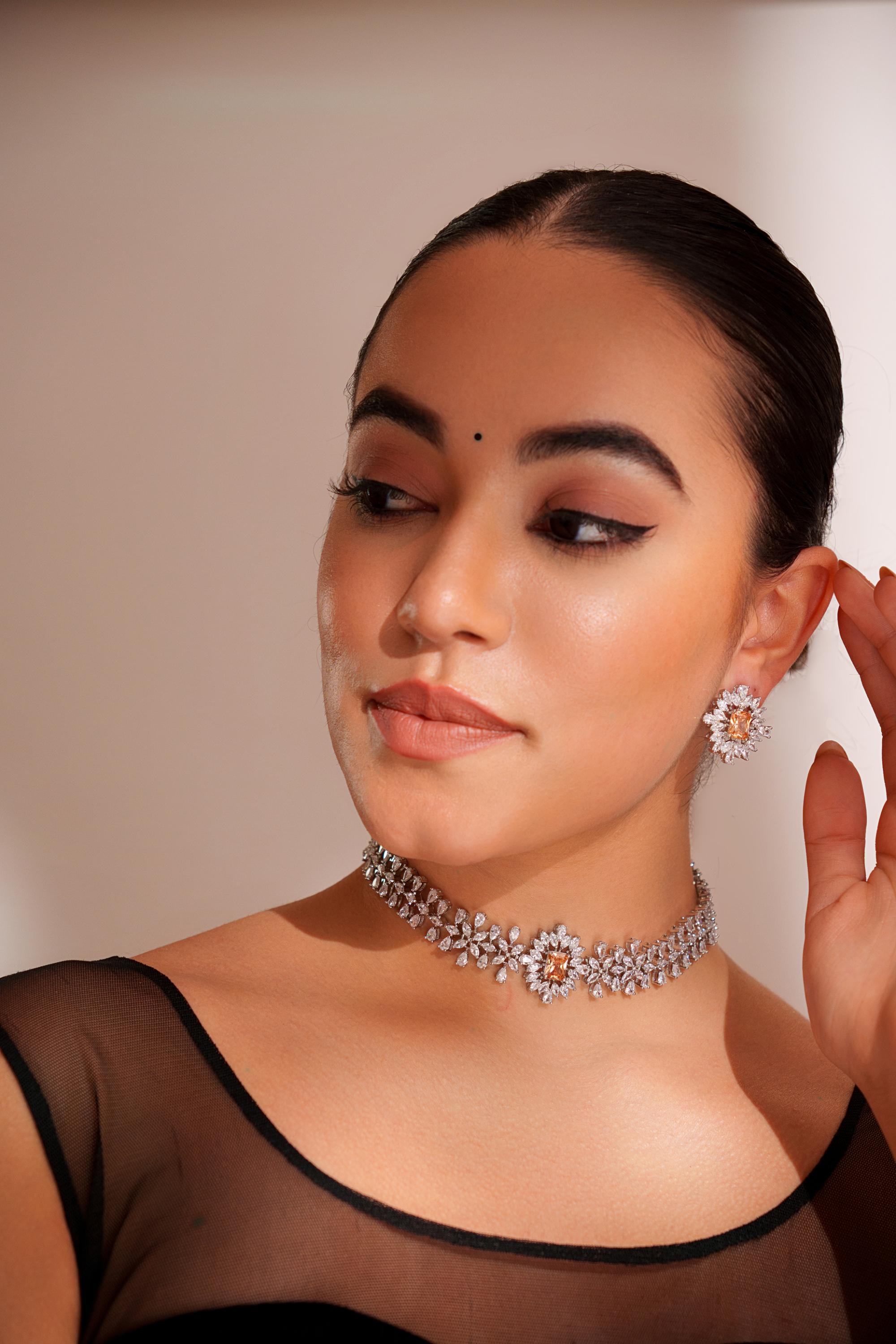Elegant diamond choker with peach stone and earrings