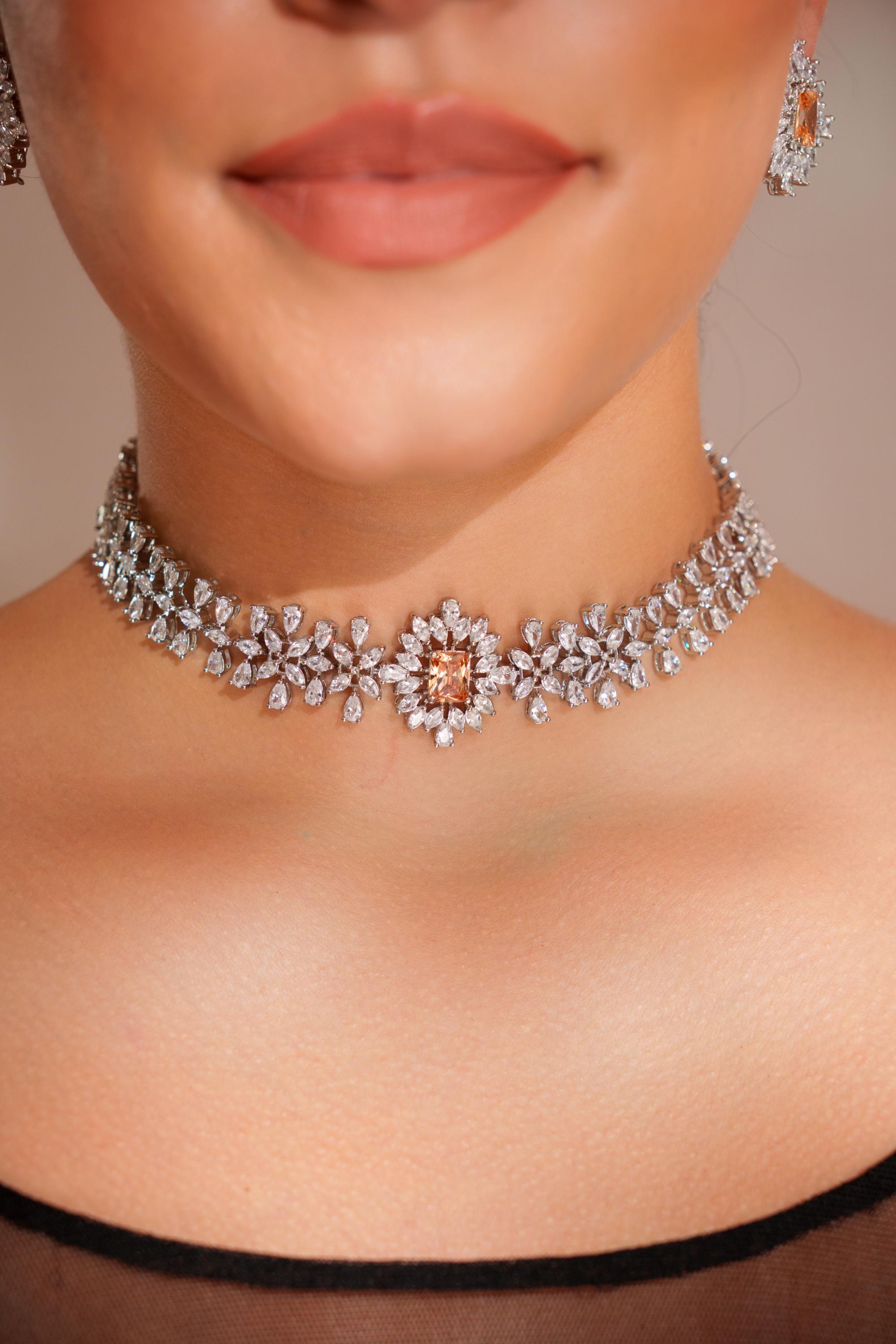 Elegant diamond choker with peach stone and earrings