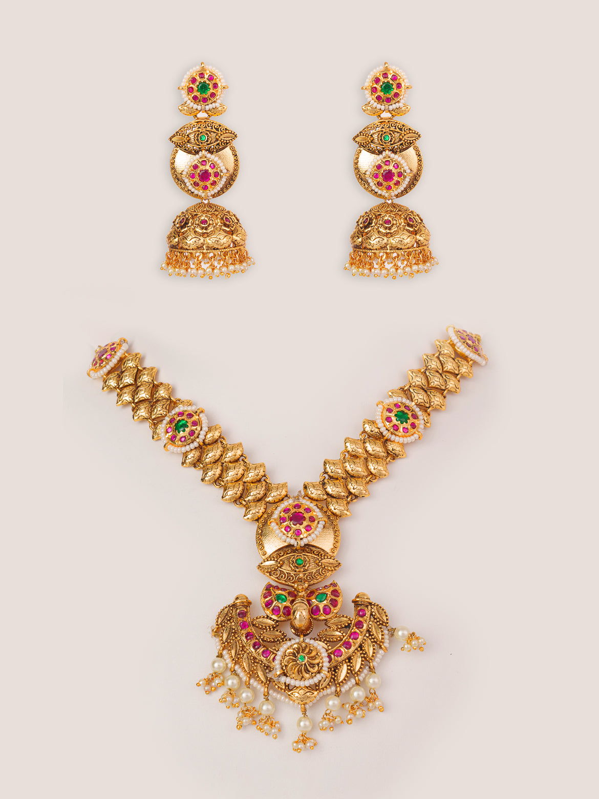 Traditional yet classic kundan temple necklace with elegant pair of earrings