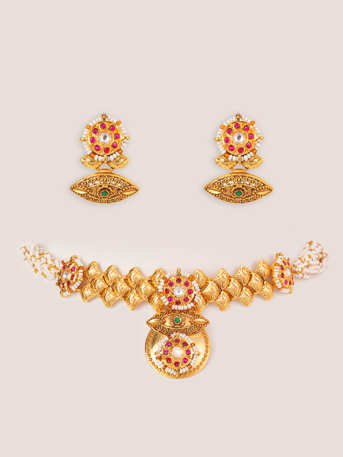 Traditional yet classic kundan temple choker with elegant pair of earrings.
