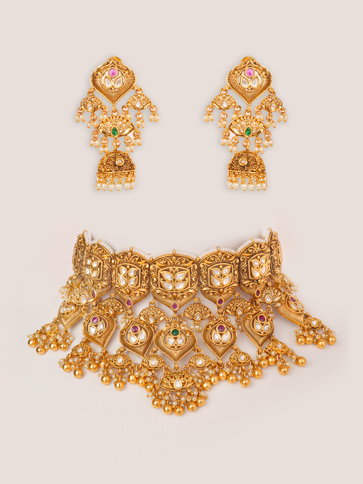 Traditional yet classic kundan temple necklace with elegant pair of earrings