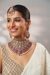 Bold and dramatic polki necklace set with matching earrings and maangtika