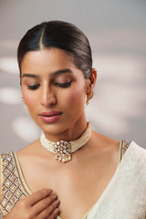 Classy kundan choker set with elegant pair of earrings.
