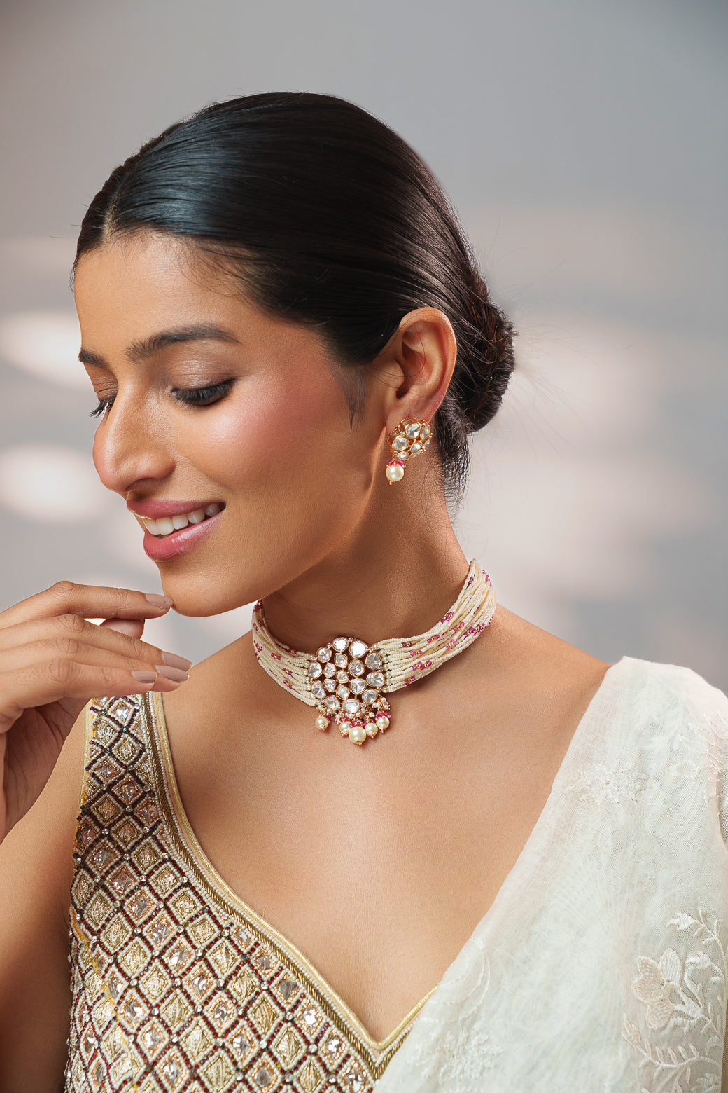 Classy kundan choker set with elegant pair of earrings.