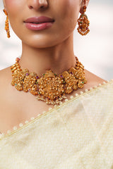 Traditional yet classic kundan temple necklace with elegant pair of earrings