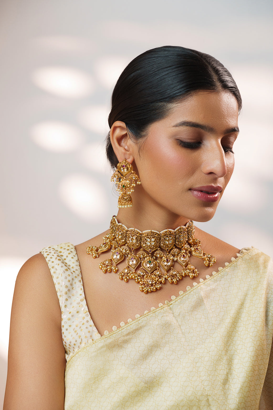 Traditional yet classic kundan temple necklace with elegant pair of earrings