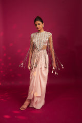 Peachy Pink ajrakh stripwork jacket paired up with Peachy pink bralette and drape dhoti skirt
