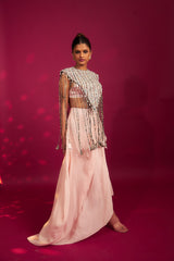 Peachy Pink ajrakh stripwork jacket paired up with Peachy pink bralette and drape dhoti skirt