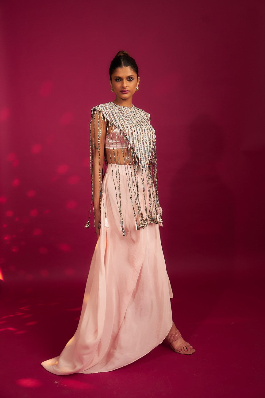 Peachy Pink ajrakh stripwork jacket paired up with Peachy pink bralette and drape dhoti skirt