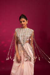 Peachy Pink ajrakh stripwork jacket paired up with Peachy pink bralette and drape dhoti skirt