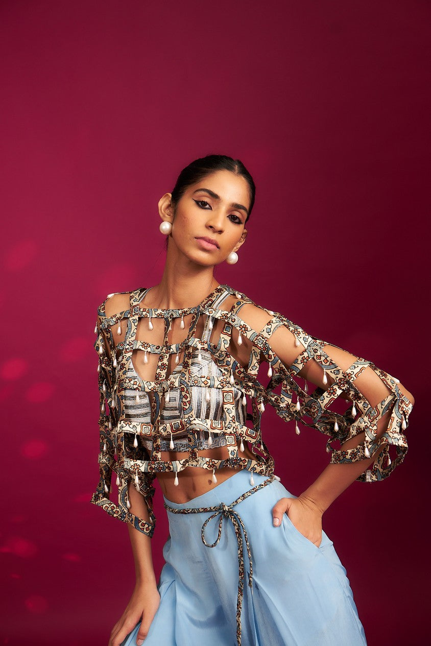 Powder blue ajrakh stripped jacket with embellished brallete and inverted pleated pants
