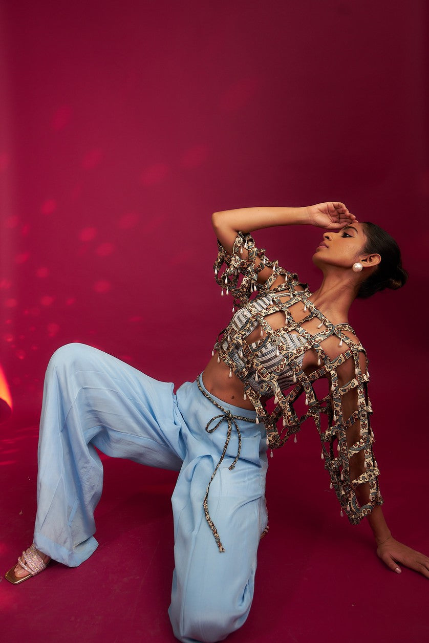 Powder blue ajrakh stripped jacket with embellished brallete and inverted pleated pants