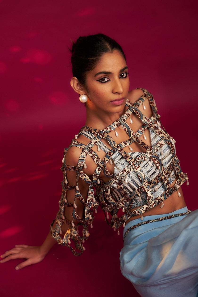 Powder blue ajrakh stripped jacket with embellished brallete and inverted pleated pants