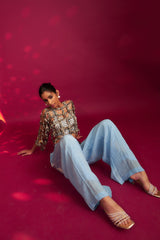 Powder blue ajrakh stripped jacket with embellished brallete and inverted pleated pants