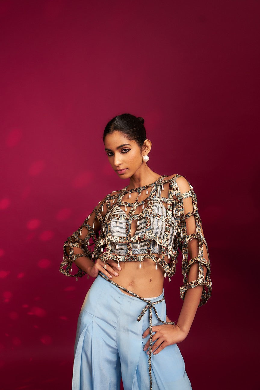 Powder blue ajrakh stripped jacket with embellished brallete and inverted pleated pants