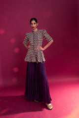 Purple fully embellished ajrakh peplum top with tiered sharara set