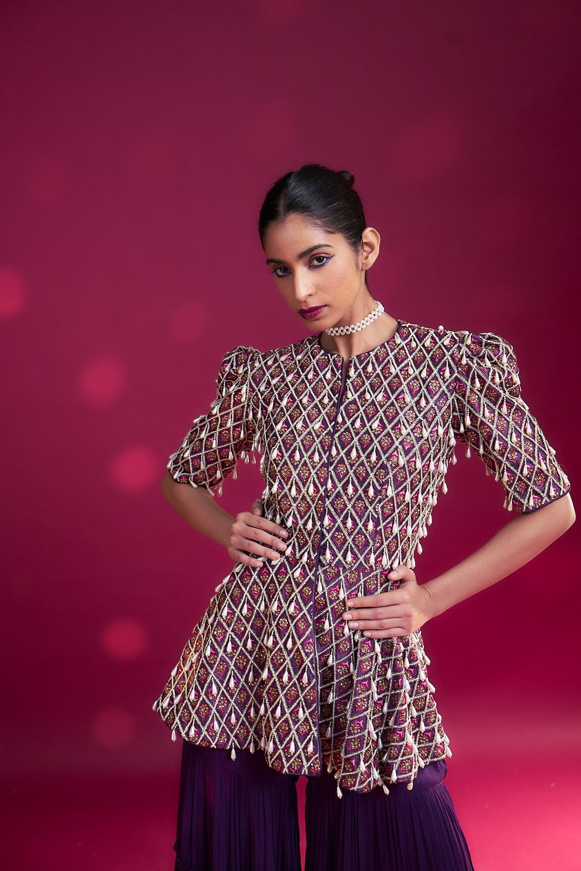 Purple fully embellished ajrakh peplum top with tiered sharara set