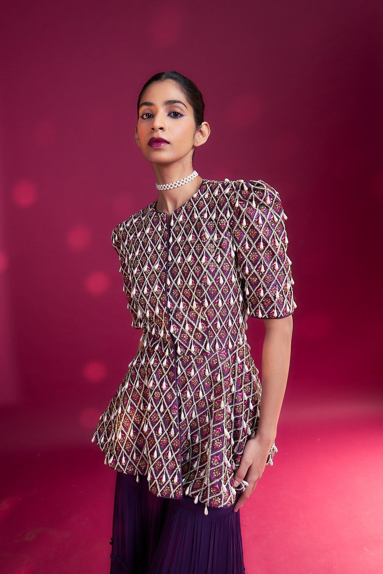 Purple fully embellished ajrakh peplum top with tiered sharara set