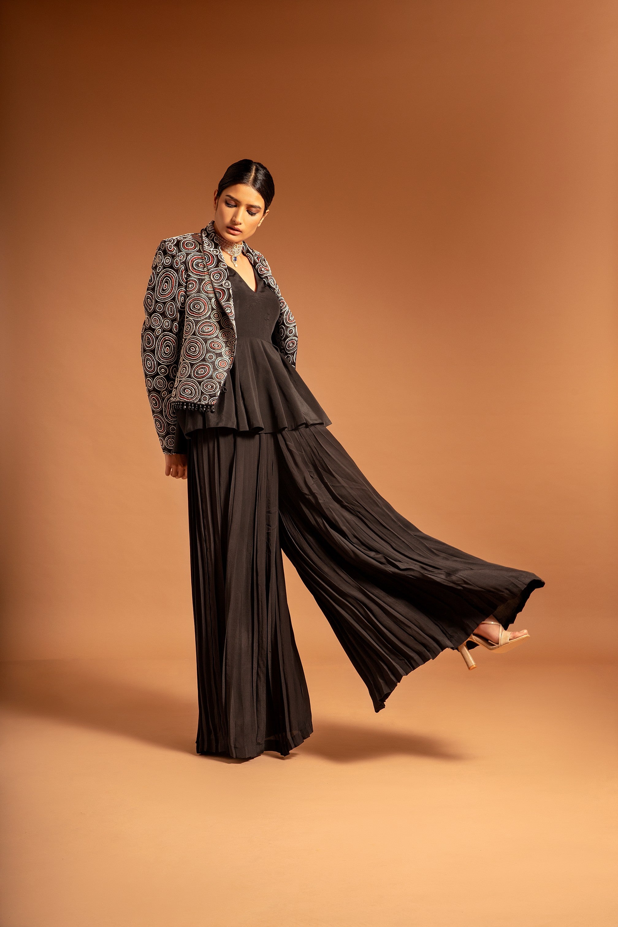 Black fully embroidered jacket with peplum top and pleated pants