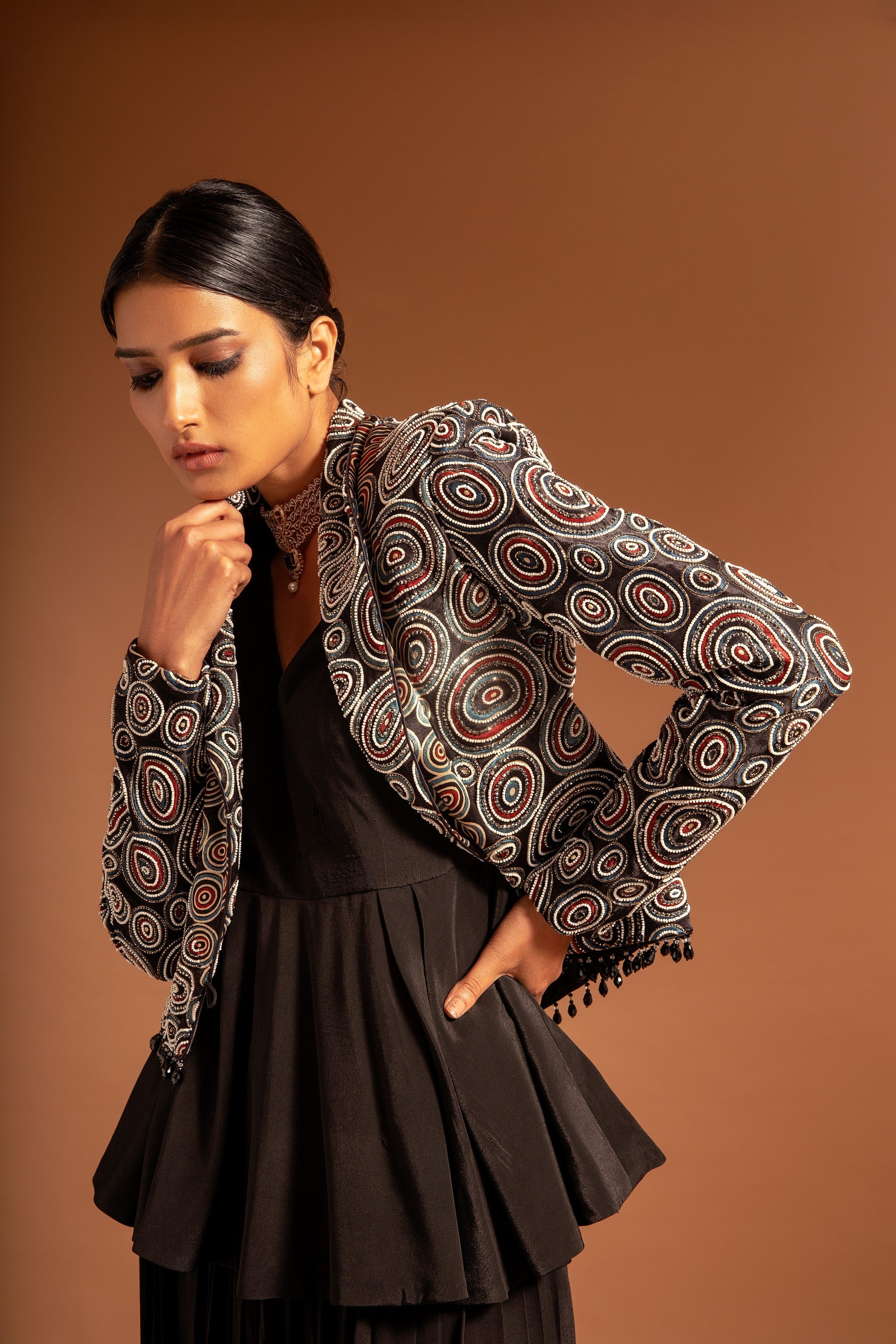 Black fully embroidered jacket with peplum top and pleated pants