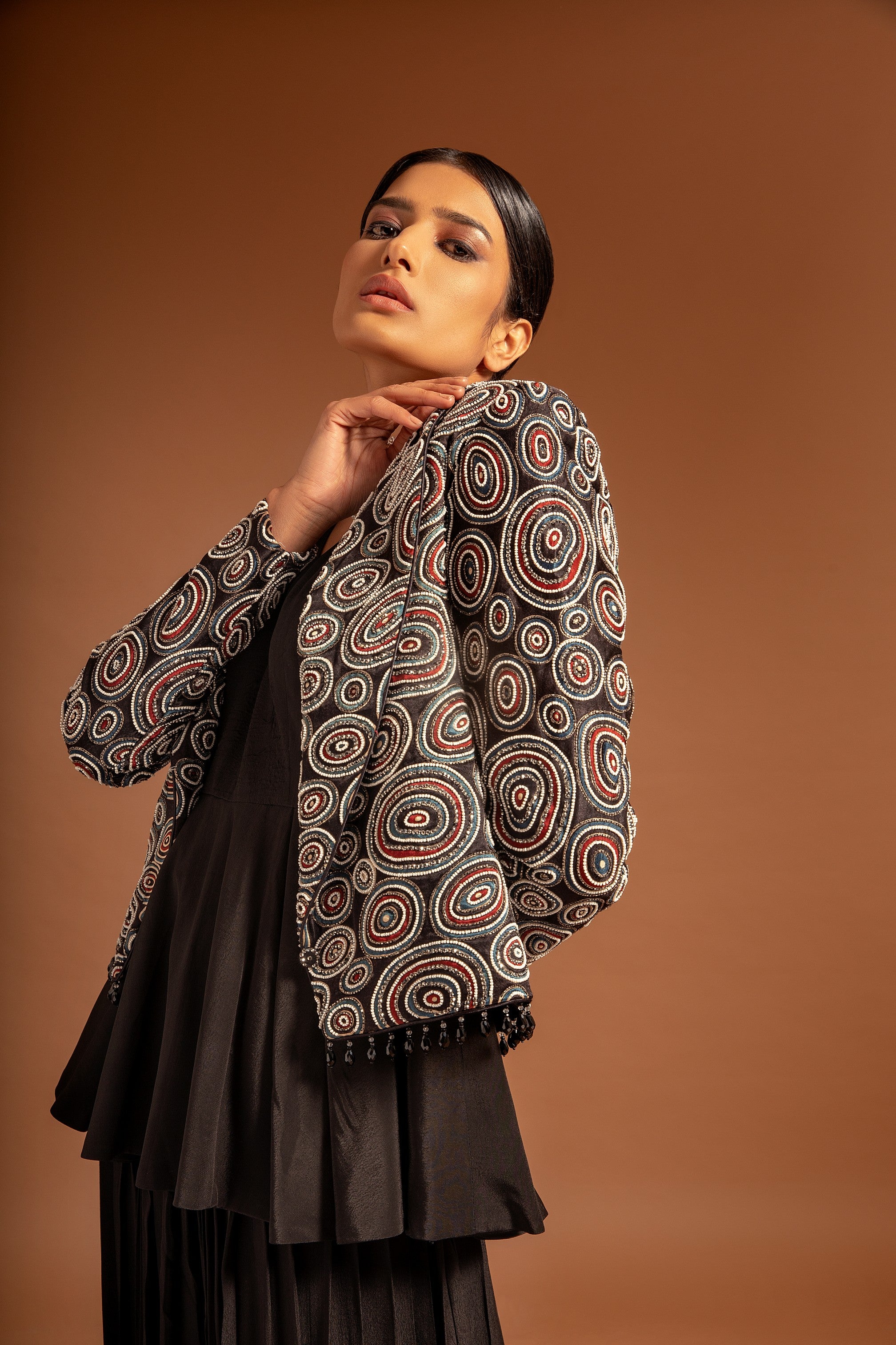 Black fully embroidered jacket with peplum top and pleated pants